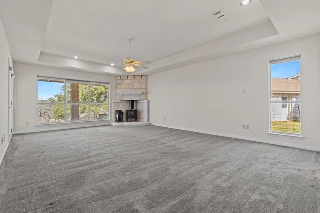 a view of an empty room with a window