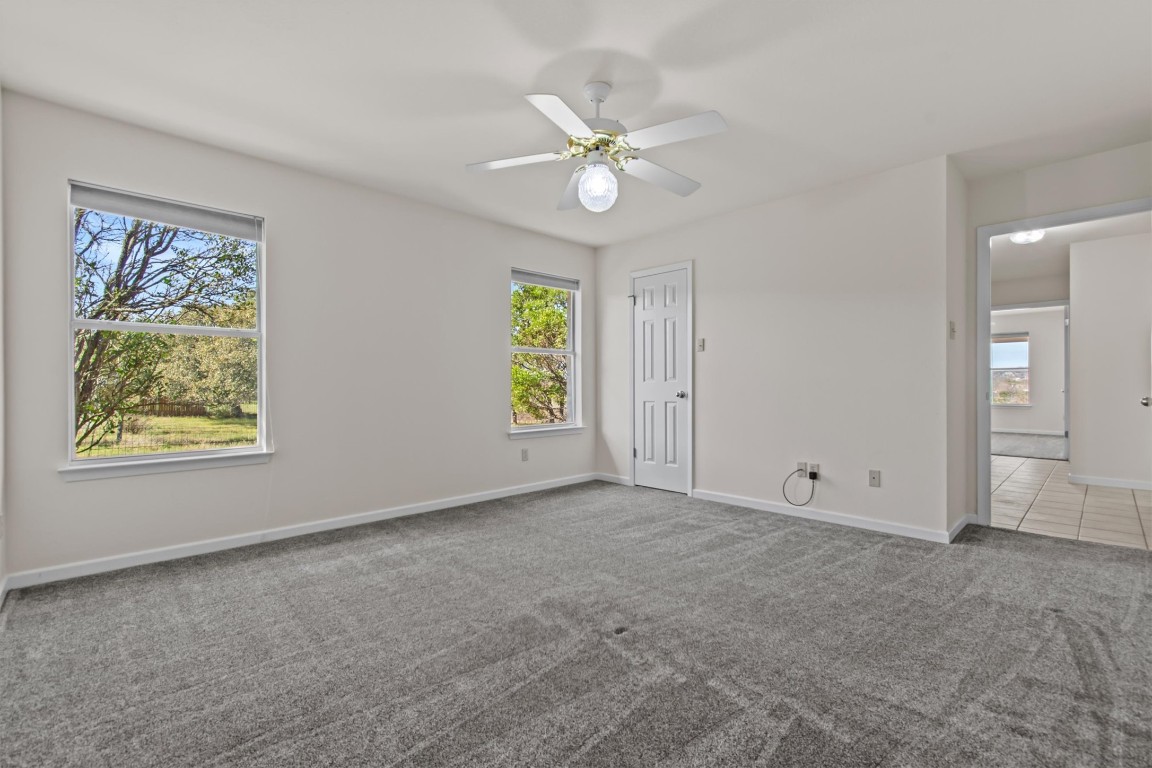 25048 River Road Spicewood, TX 78669 - Photo 16 of 33 a view of an empty room with a window