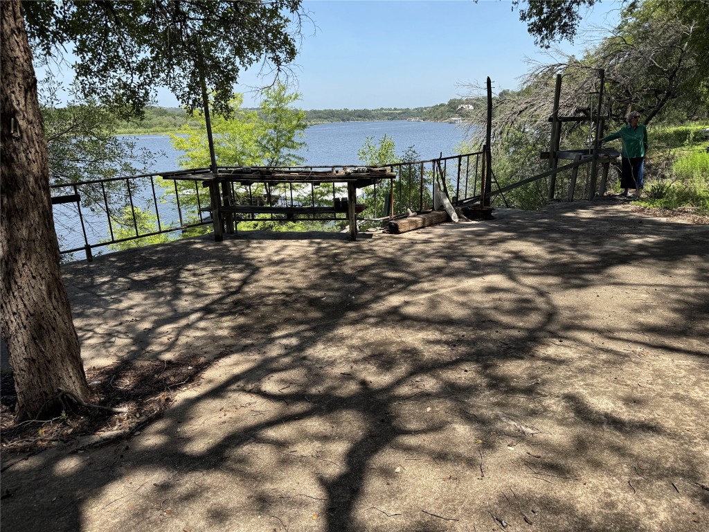 25048 River Road Spicewood, TX 78669 - Photo 22 of 33 Concrete patio above dock and river