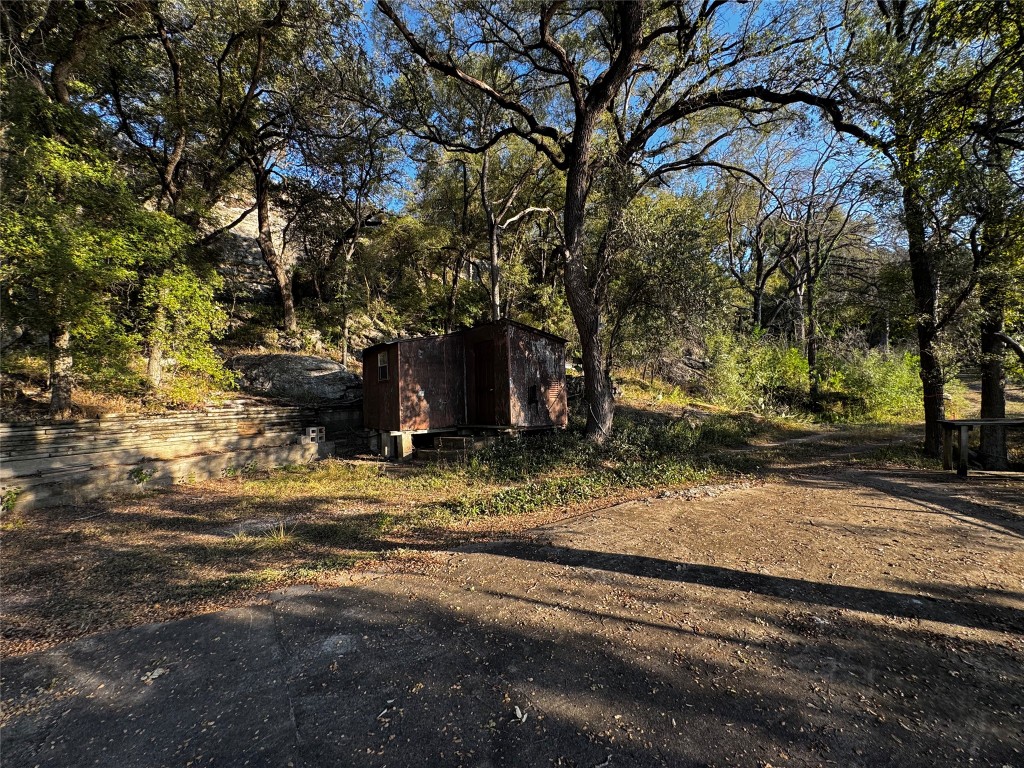 25048 River Road Spicewood, TX 78669 - Photo 24 of 33 a view of a yard with a tree