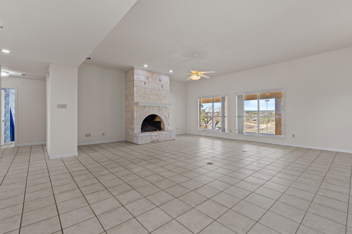 25048 River Road Spicewood, TX 78669 - Photo 4 of 33 an empty room with windows and entrance