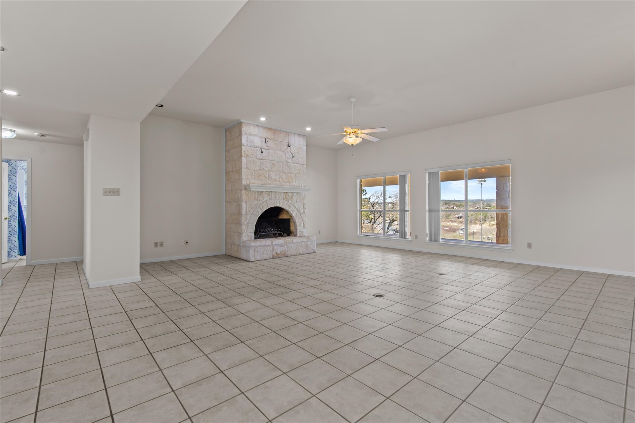 25048 River Road Spicewood, TX 78669 - Photo 4 of 33 Freshly painted; Living room with fireplace