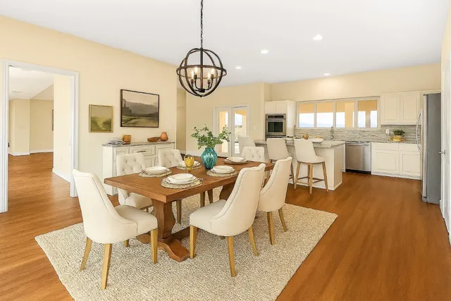 an empty room with a fireplace and cabinet