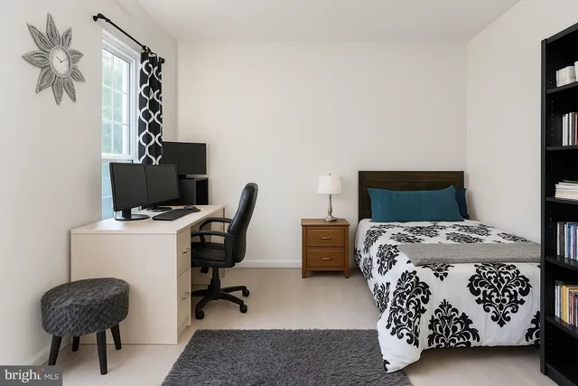 a bedroom with a bed and a chair