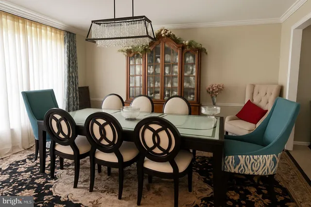 a dining room with furniture and window