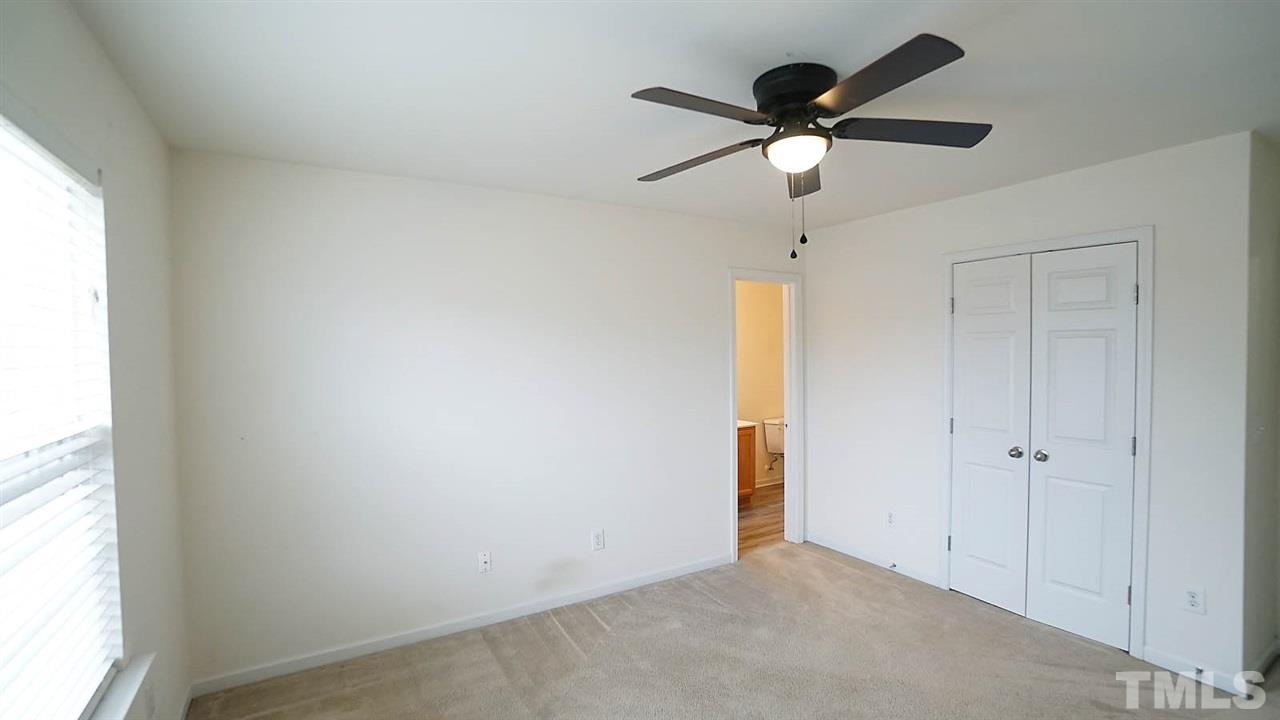 8311 Martello Lane Raleigh, NC 27613 - Photo 24 of 30 a view of an empty room and a window