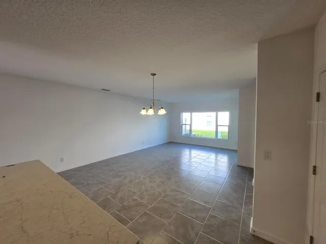 a view of empty room with windows