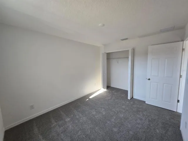 a bathroom with a glass shower door and a sink