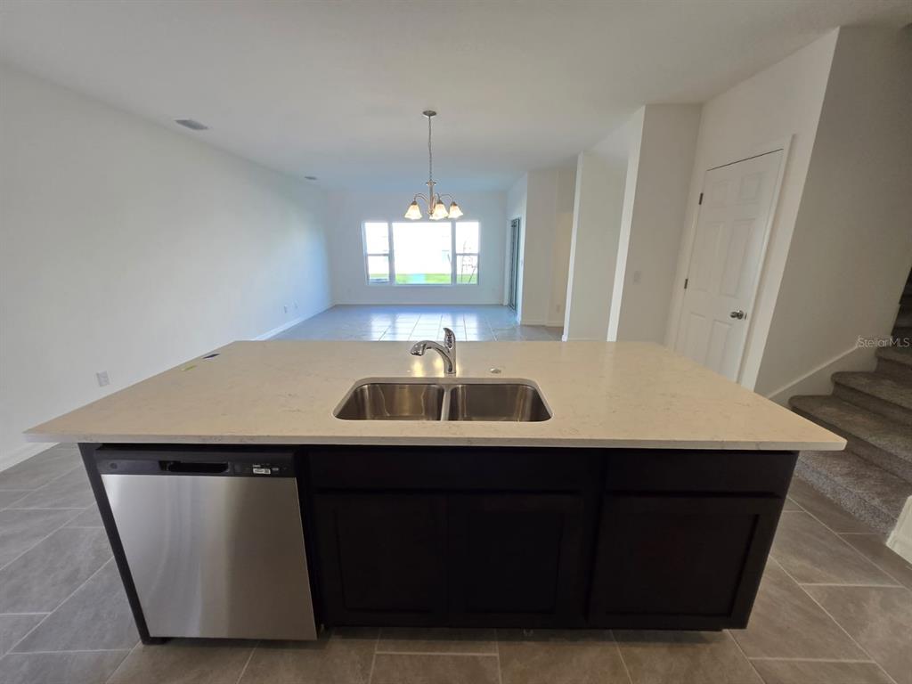 4827 Noble Cypress Street Kissimmee, FL 34746 - Photo 5 of 29 a room with table and window