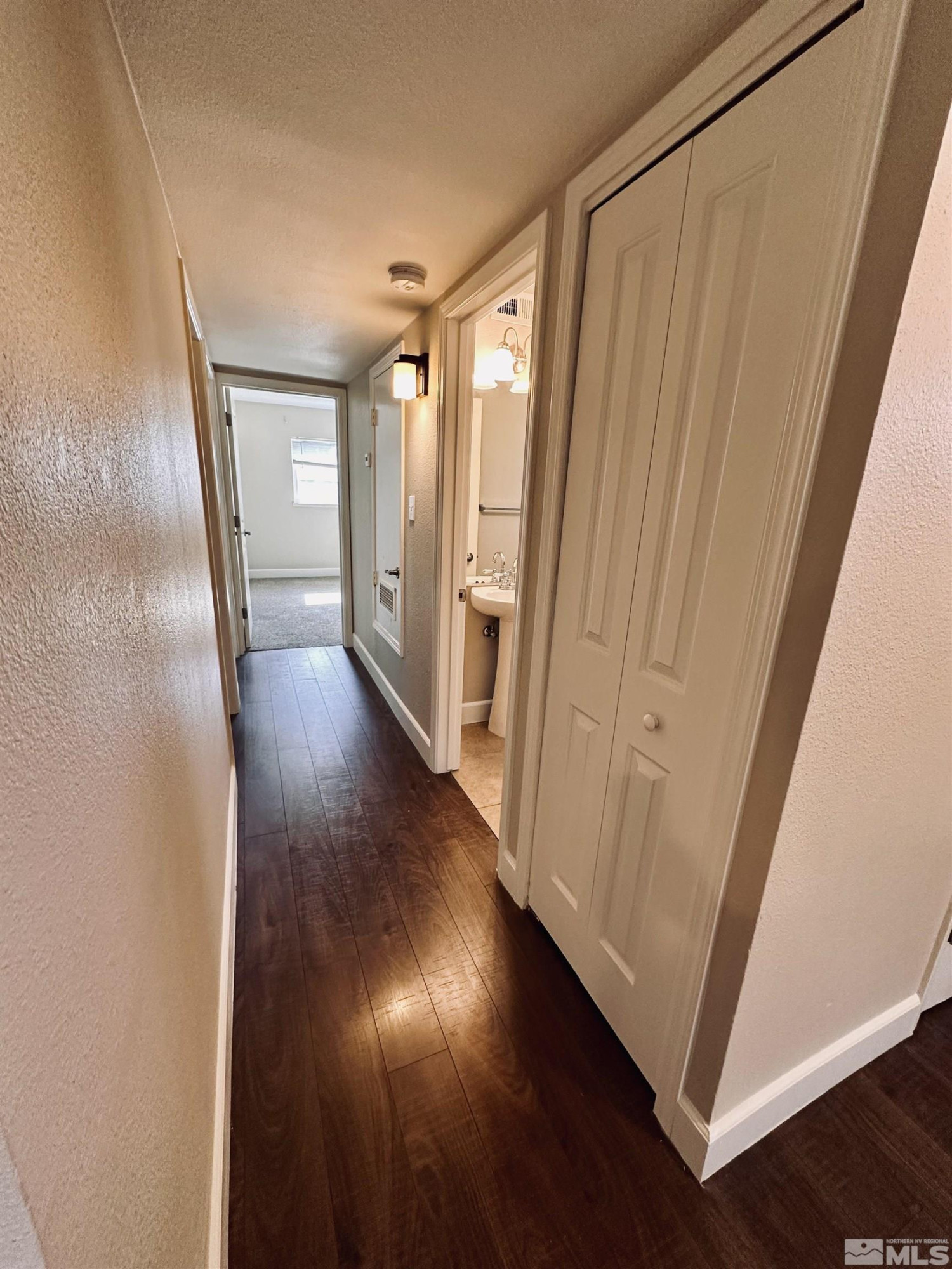 1945 Gridley Avenue Reno, NV 89503 - Photo 12 of 27 a view of a hallway with wooden floor