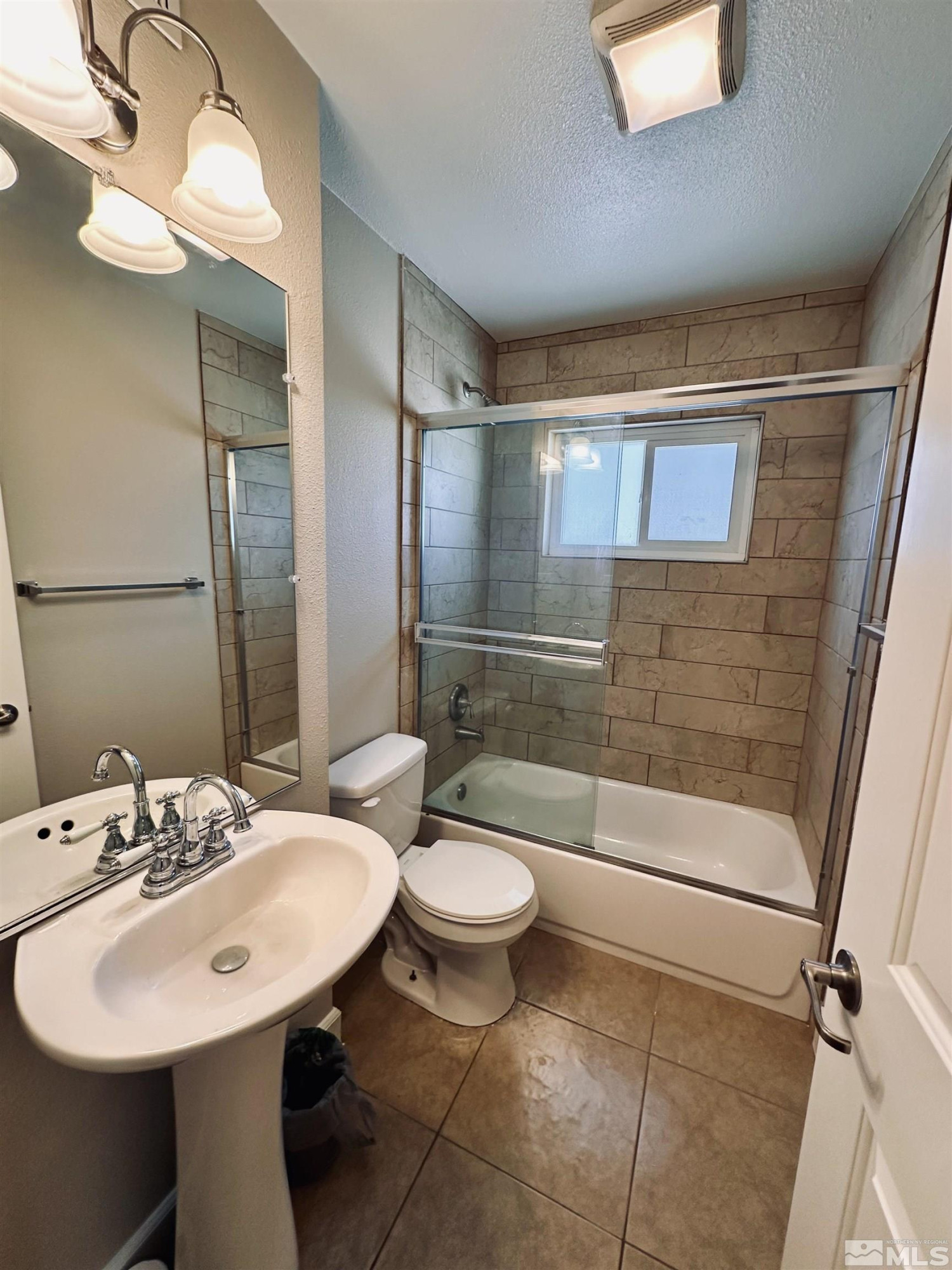 1945 Gridley Avenue Reno, NV 89503 - Photo 13 of 27 a bathroom with a sink toilet and shower