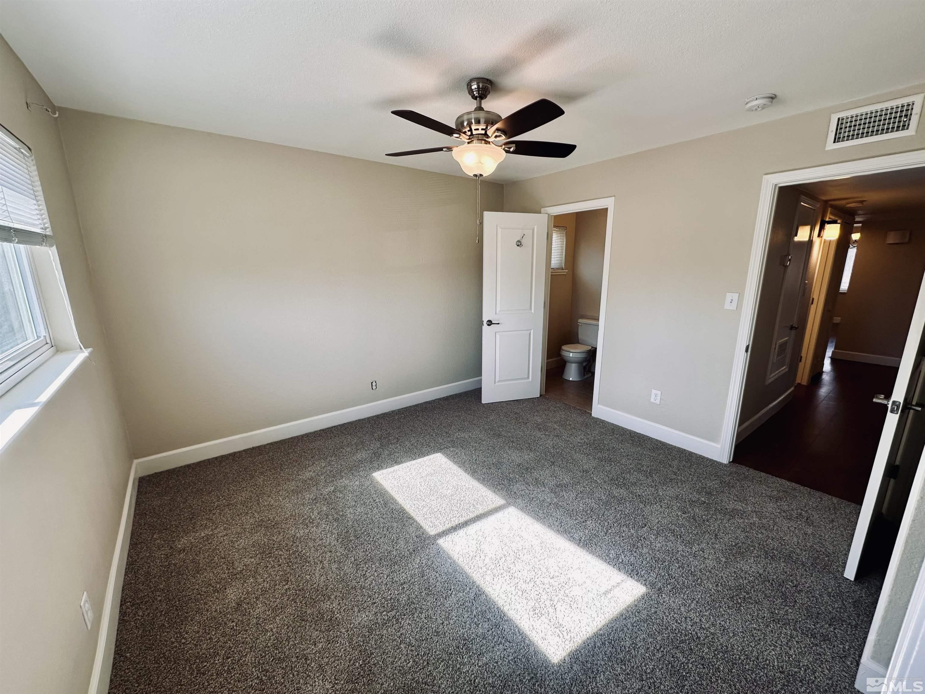 1945 Gridley Avenue Reno, NV 89503 - Photo 19 of 27 an empty room with closet and a ceiling fan