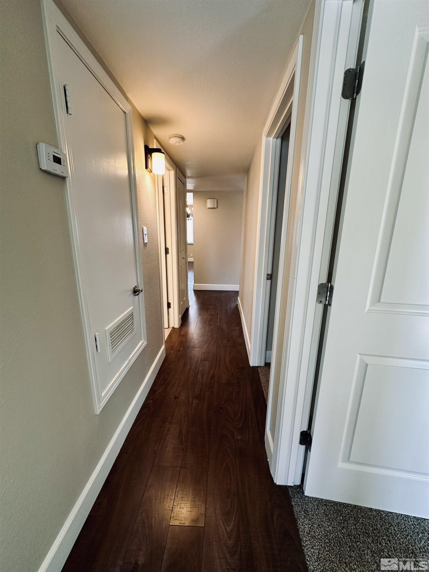 1945 Gridley Avenue Reno, NV 89503 - Photo 22 of 27 a view of a hallway with wooden floor and staircase