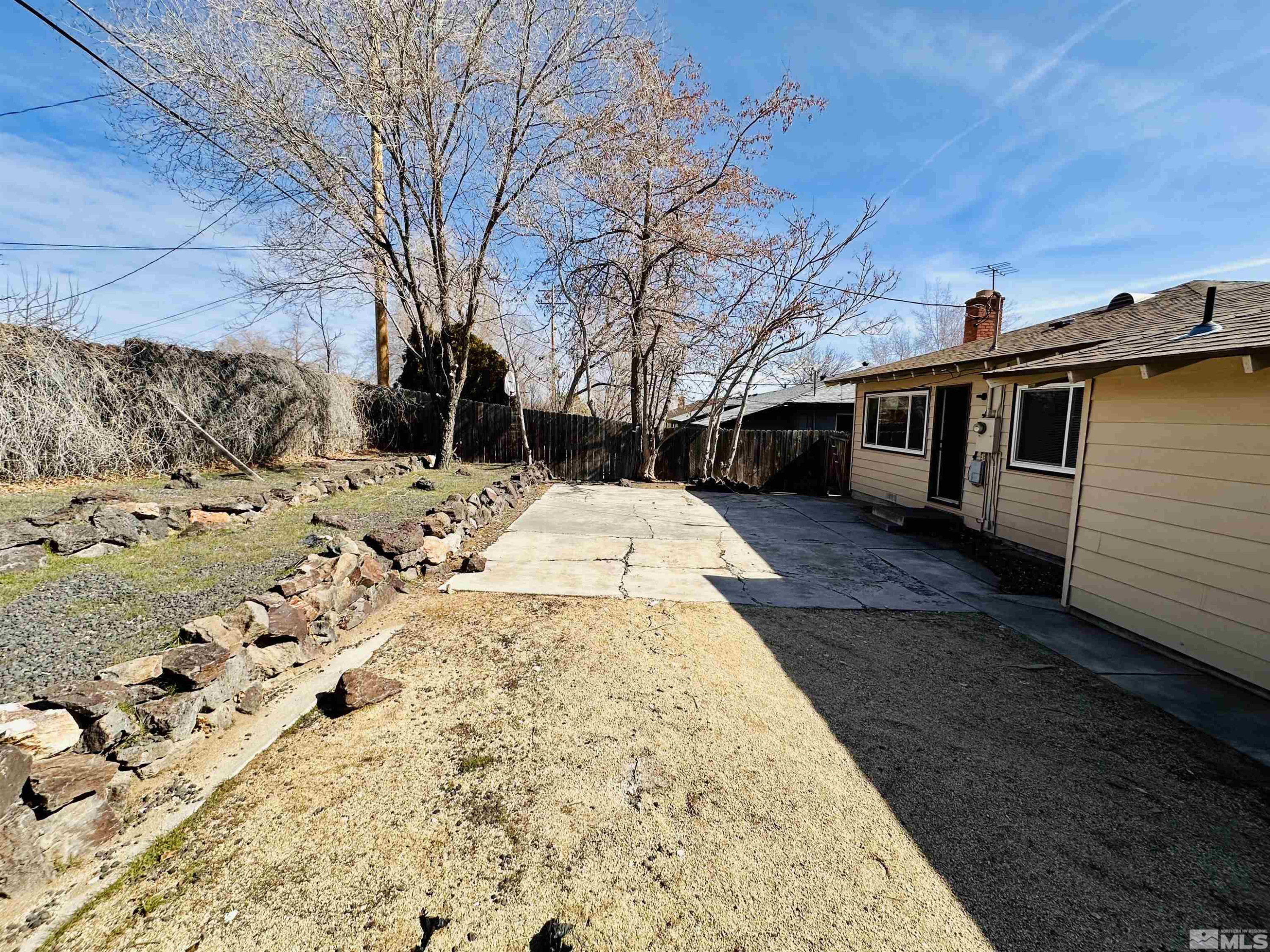 1945 Gridley Avenue Reno, NV 89503 - Photo 24 of 27 a view of a backyard with snow on the road