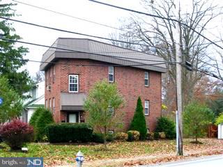 206 Rockingham Road Bryn Mawr, PA 19010 - Photo 1 of 6 a front view of a house with garden