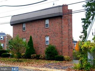206 Rockingham Road Bryn Mawr, PA 19010 - Photo 3 of 6 a brick building with a large windows