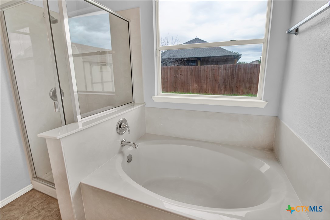 117 Bashaw Loop Temple, TX 76502 - Photo 16 of 20 a bath tub sitting next to a window