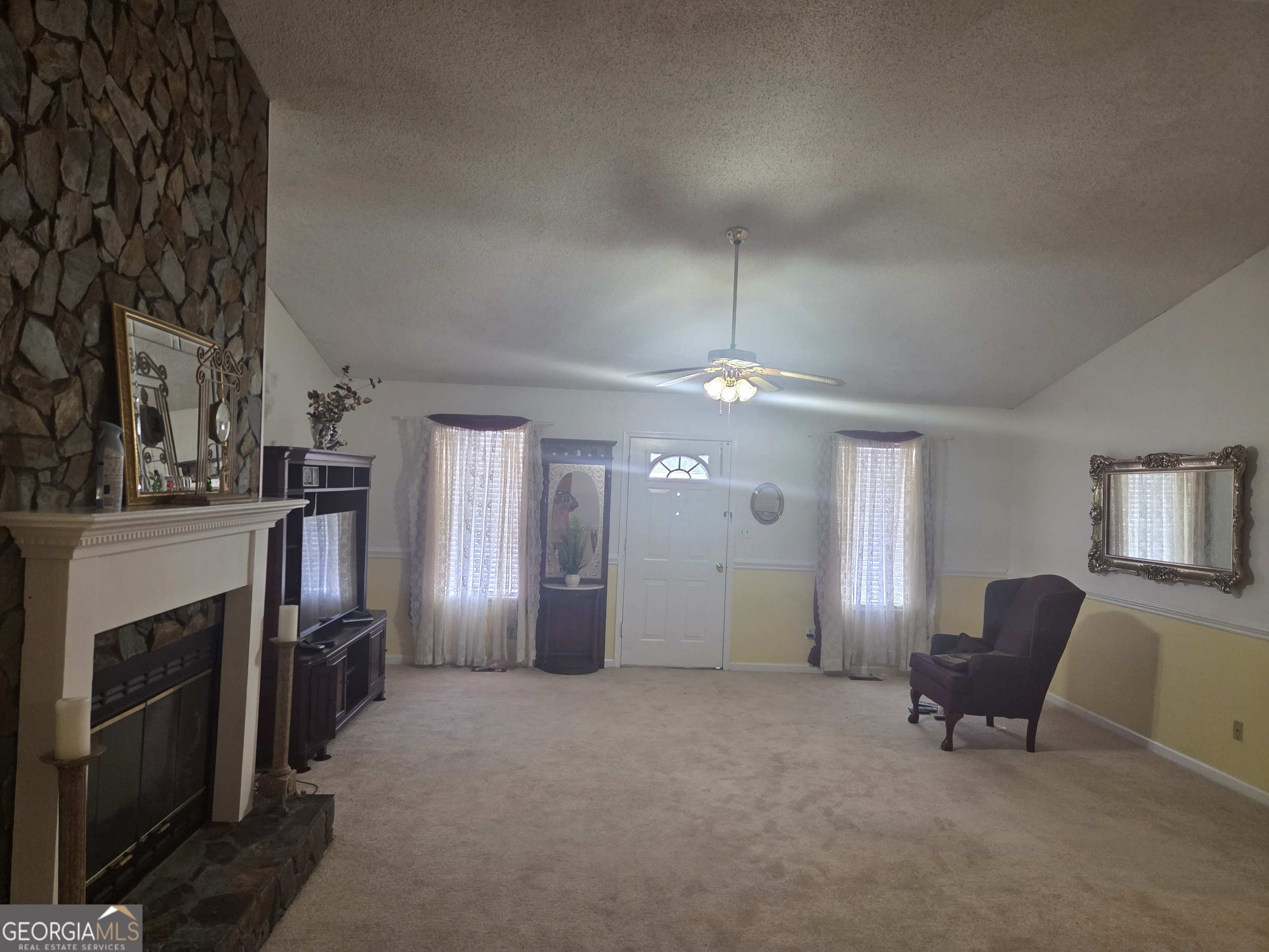 213 Lancelot Lane Dublin, GA 31021 - Photo 2 of 12 a living room with furniture and a fireplace