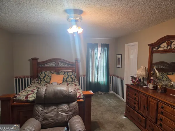 a bed room with furniture and a window