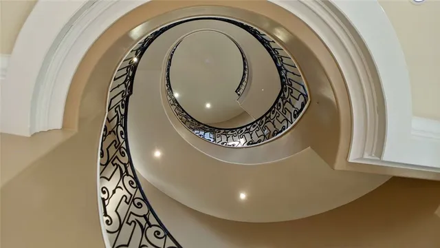 a view of a room with wooden floor and windows