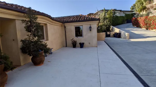a view of a field with trees in the background