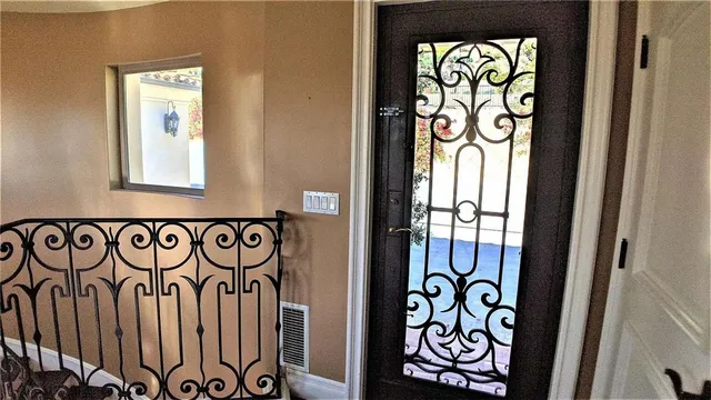 a view of a room with wooden floor and cabinet