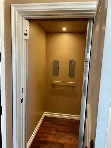 a spacious bathroom with a granite countertop sink a mirror and a shower