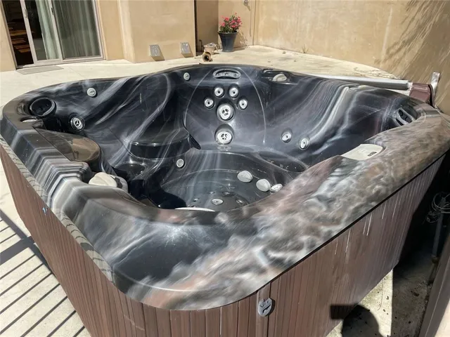 a view of a house with a yard and sitting area