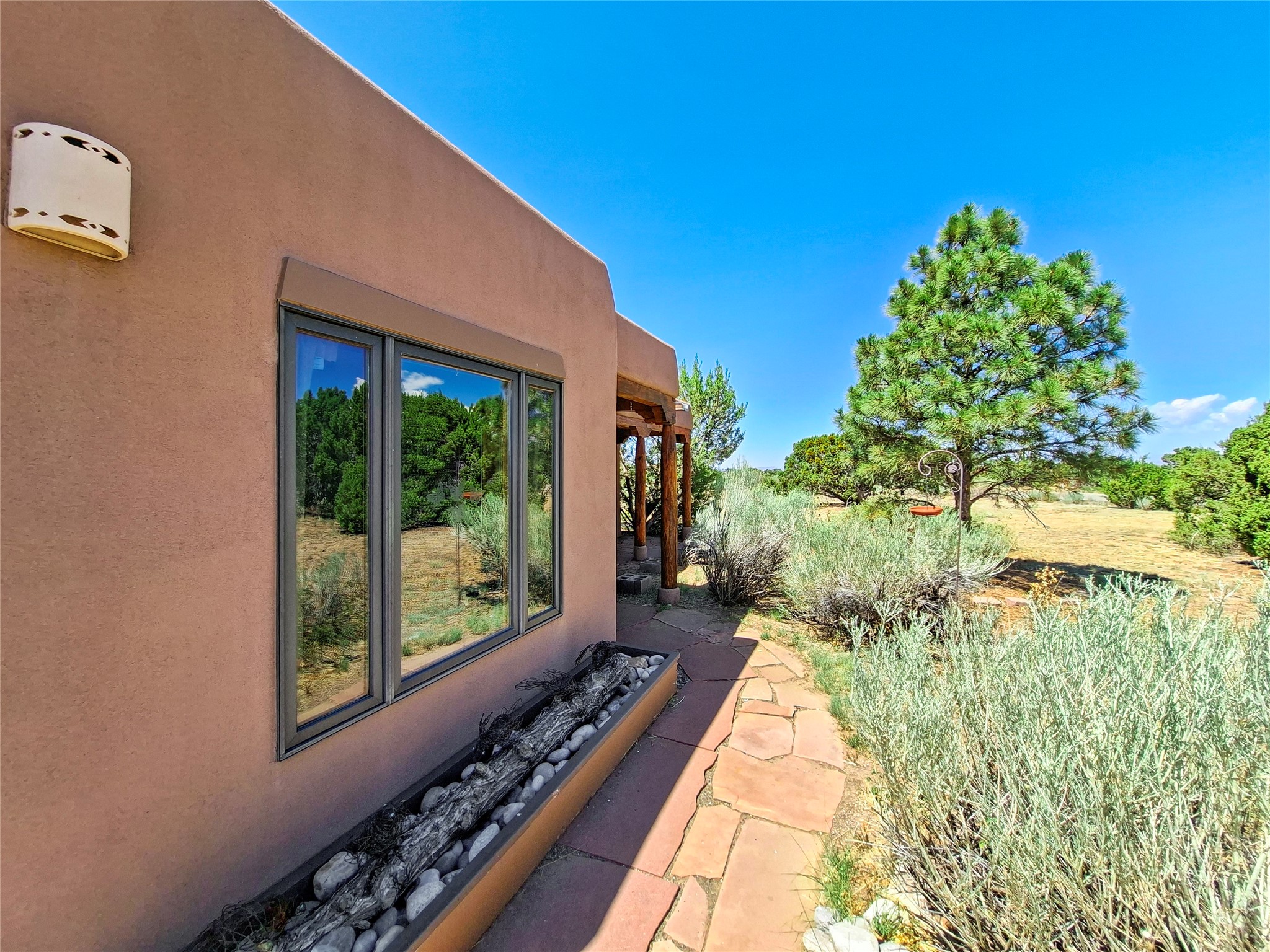 57 Verano Loop Santa Fe, NM 87508 - Photo 5 of 43 Walkway to the front door.