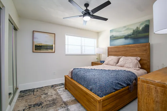 a bed room with a bed and a window