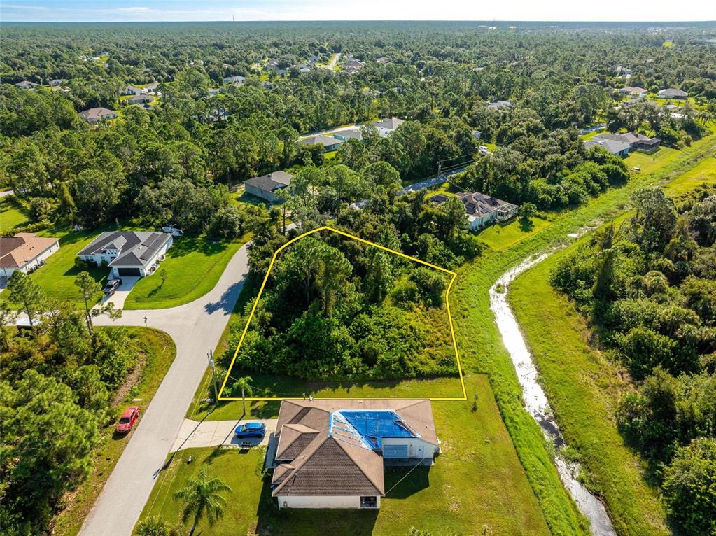 6465 Ohio Rd Port North Port, FL 34291 - Photo 13 of 34 an aerial view of residential houses with outdoor space