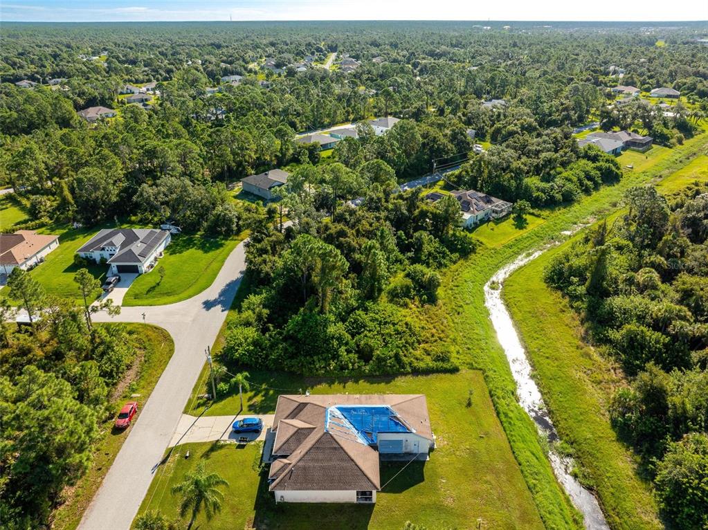 6465 Ohio Rd Port North Port, FL 34291 - Photo 14 of 34 an aerial view of residential houses with outdoor space