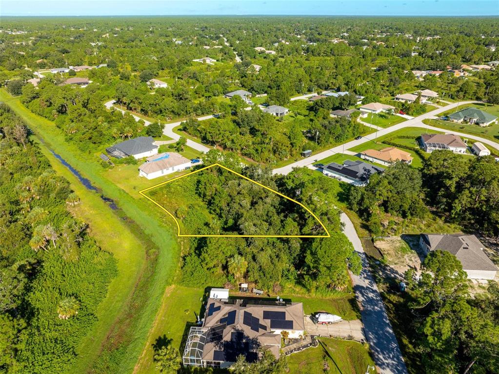 6465 Ohio Rd Port North Port, FL 34291 - Photo 17 of 34 an aerial view of residential houses with outdoor space