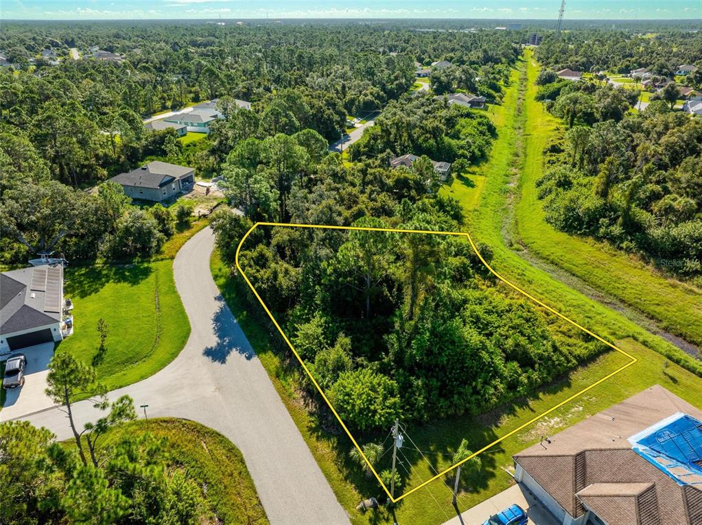 6465 Ohio Rd Port North Port, FL 34291 - Photo 25 of 34 an aerial view of residential houses with outdoor space and swimming pool