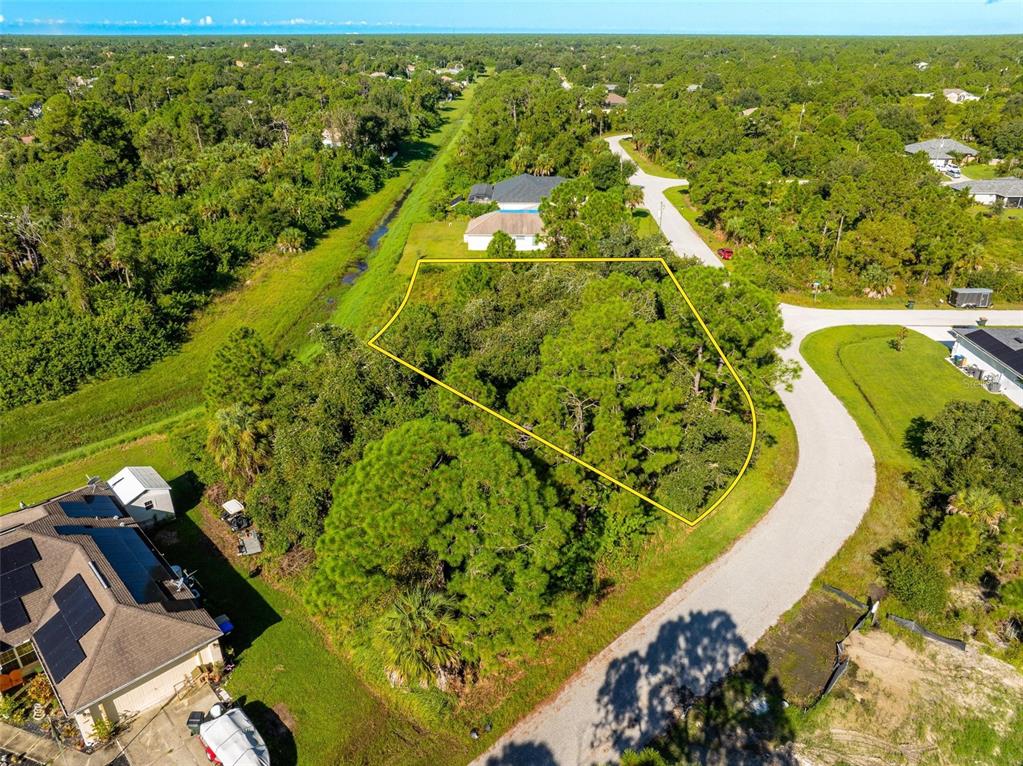 6465 Ohio Rd Port North Port, FL 34291 - Photo 29 of 34 an aerial view of residential houses with outdoor space