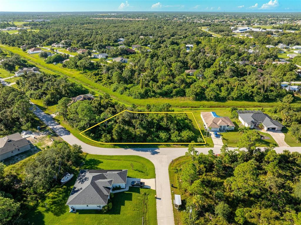 6465 Ohio Rd Port North Port, FL 34291 - Photo 3 of 34 an aerial view of a house with a yard