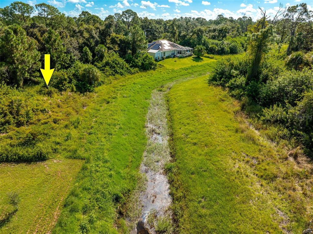 6465 Ohio Rd Port North Port, FL 34291 - Photo 33 of 34 a view of a yard with an outdoor seating