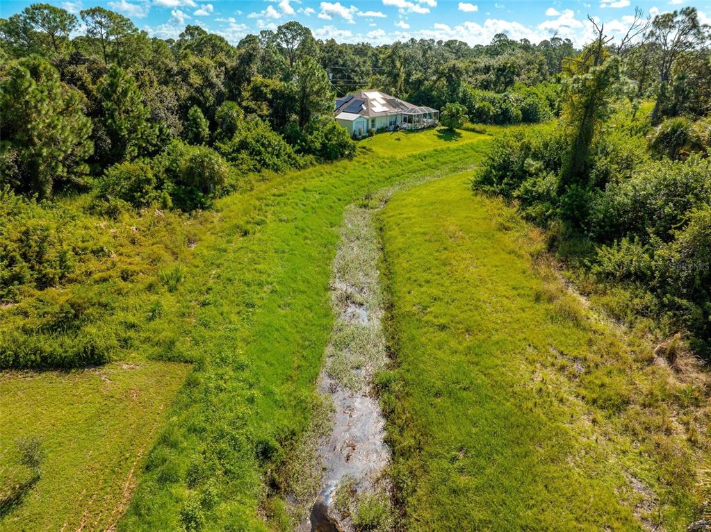 6465 Ohio Rd Port North Port, FL 34291 - Photo 34 of 34 a large yard with lots of green space