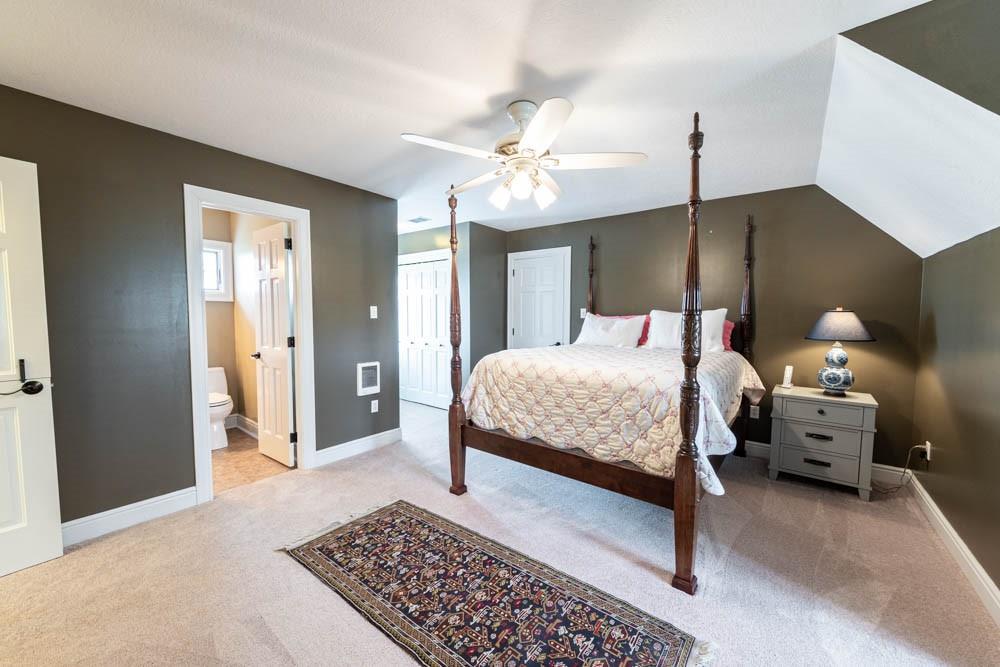 225 Levis Road Portersville, PA 16051 - Photo 12 of 24 a bedroom with a bed and a chandelier