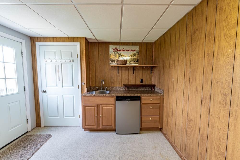 225 Levis Road Portersville, PA 16051 - Photo 20 of 24 a kitchen with stainless steel appliances granite countertop a stove a sink and a refrigerator