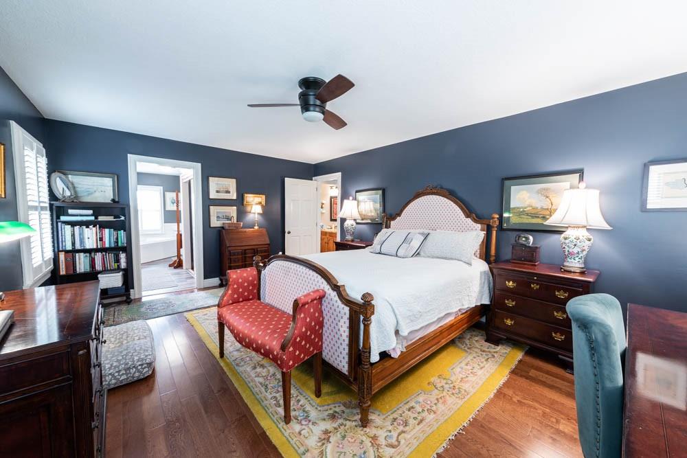 225 Levis Road Portersville, PA 16051 - Photo 8 of 24 a bedroom with a large bed and wooden floor