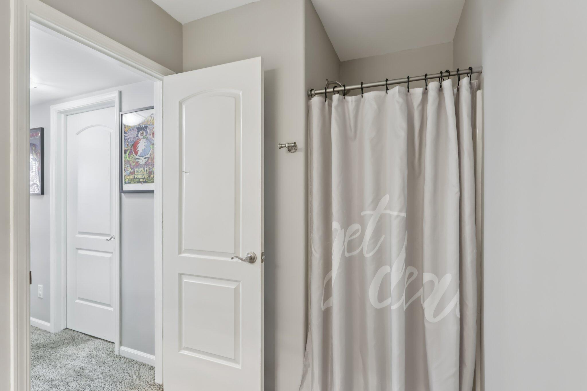 2235 Coldspring Road Crown Point, IN 46307 - Photo 20 of 51 a view of a bathroom with a shower curtain