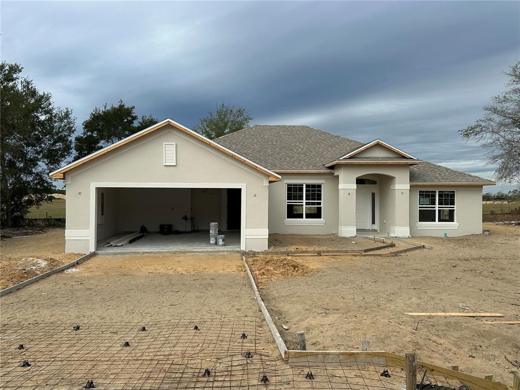 a front view of a house with yard