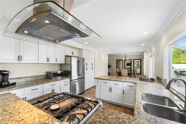 a kitchen with a sink stove and refrigerator