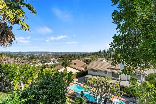 a view of a patio with table and chairs potted plants with wooden floor