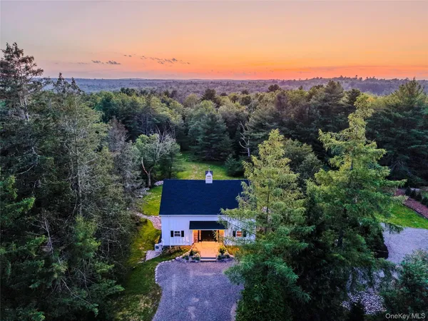 an aerial view of a house with a garden