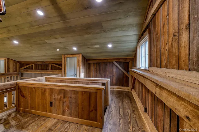 a view of a house with wooden deck