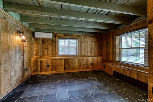 a bathroom with a mirror and a shower