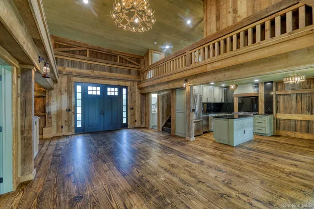 a view of an entryway with wooden floors