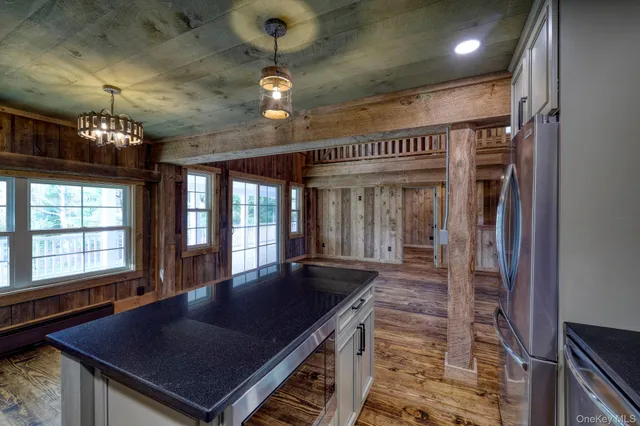 an open kitchen with a table and chairs